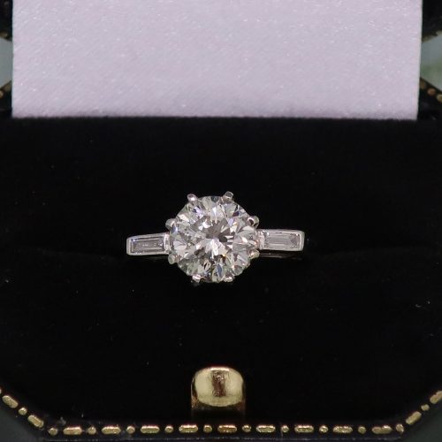 Platinum Brilliant Cut Diamond Solitaire With Diamond Shoulders