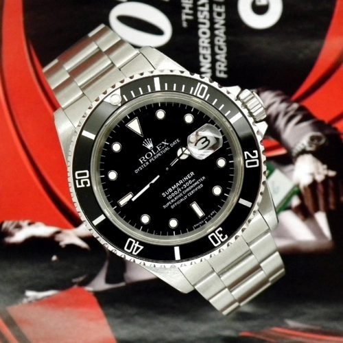 Mint stainless steel Rolex Submariner date with papers